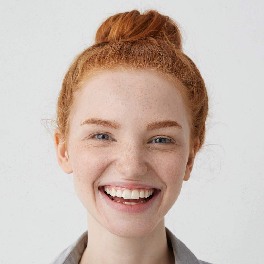 Young woman smiling confidently with bright, healthy-looking teeth