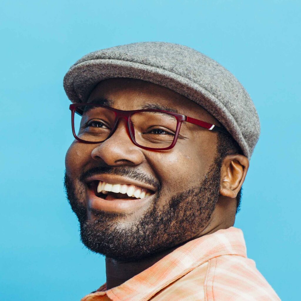 Smiling man showing healthy teeth after maintaining regular preventive dental care