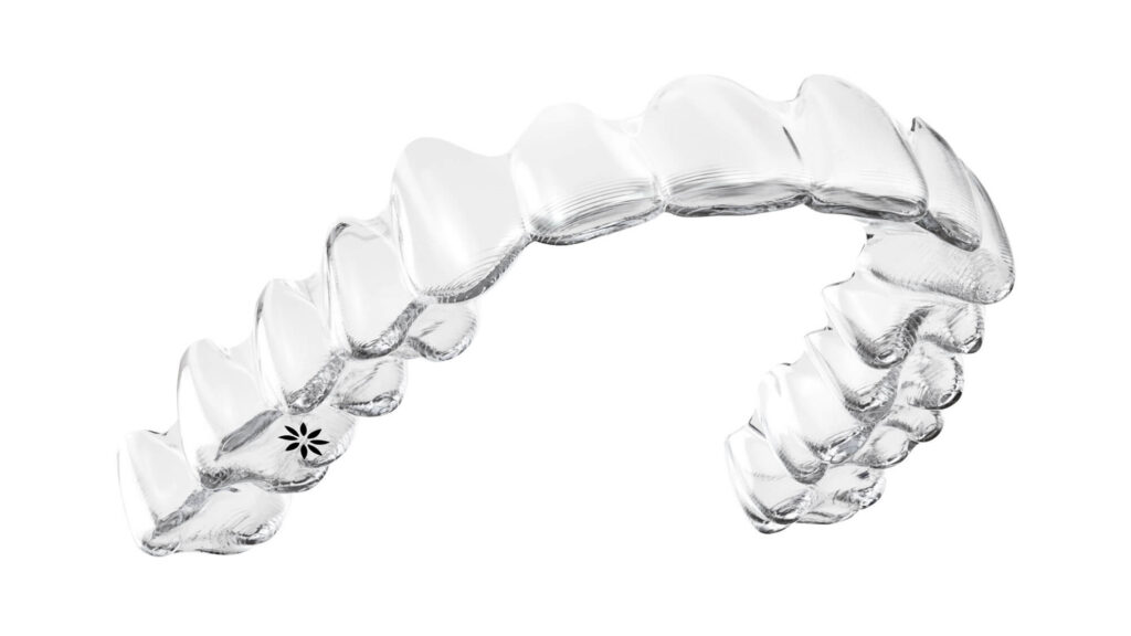 Clear Invisalign aligners used to discreetly straighten teeth and improve smile alignment