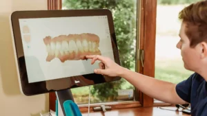 Dr. Matthew Liesen using the iTero digital scanner for dental treatment planning in Collinsville, IL