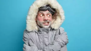 Man bundled for cold weather representing winter-related tooth sensitivity and oral health concerns