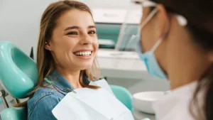 Smiling patient relaxing in a dental chair during a comfortable routine appointment