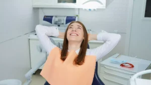 Relaxed patient smiling in the dental chair during a comfortable dentistry appointment