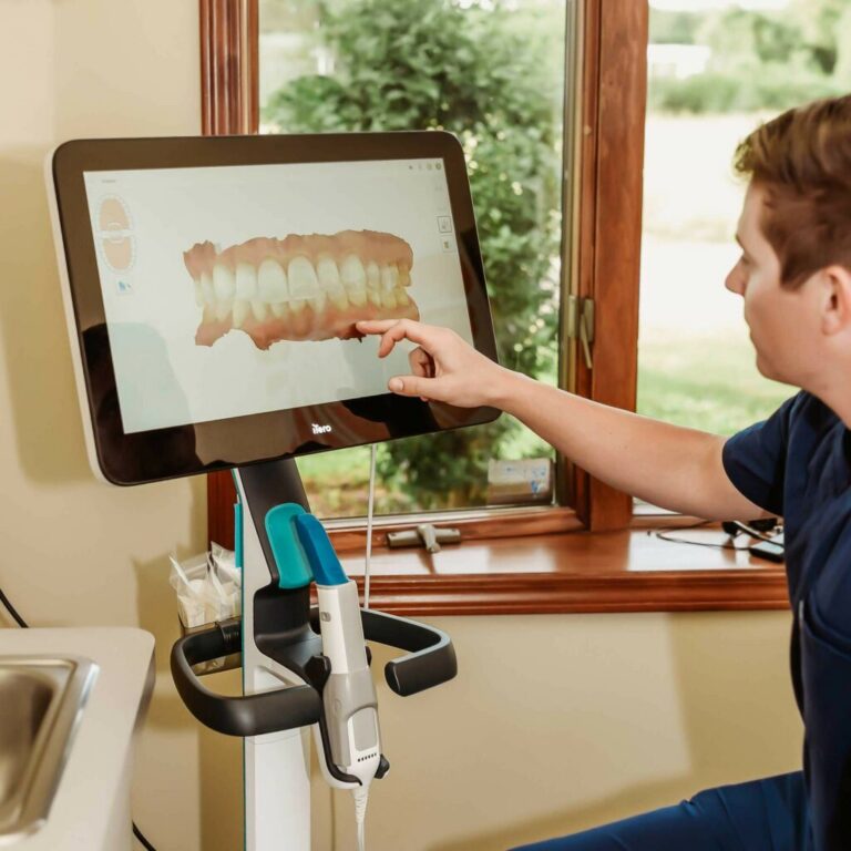 Dr. Matthew Liesen showing a patient an iTero digital scan at Liesen Family Dental