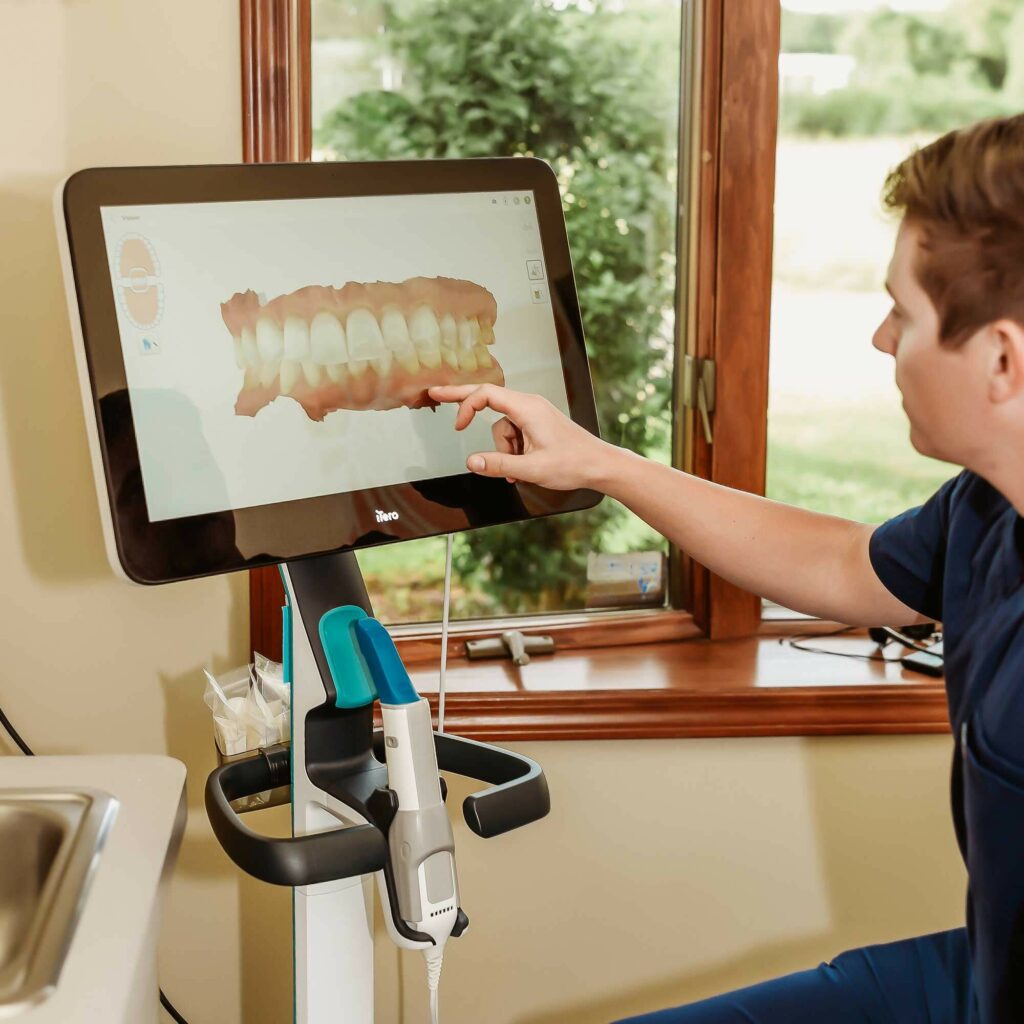 Dr. Matthew Liesen showing a patient an iTero digital scan at Liesen Family Dental